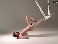 Flexible Russian gymnast Sofia Zhiraf gets naked in the aerial hammock